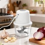 Designed for everyday convenience, this compact chopper features a powerful high-speed motor, six stainless steel blades, and a 400ml food-grade bowl, making it ideal for chopping garlic, onions, peppers, herbs, vegetables, nuts, meat, and more