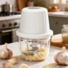 Designed for everyday convenience, this compact chopper features a powerful high-speed motor, six stainless steel blades, and a 400ml food-grade bowl, making it ideal for chopping garlic, onions, peppers, herbs, vegetables, nuts, meat, and more