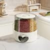 Rotating multi-compartment grain storage dispenser with airtight lid and one-touch dispensing system