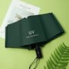 Compact UV sun protection folding umbrella with UPF 50+ canopy for rain and sunshine
